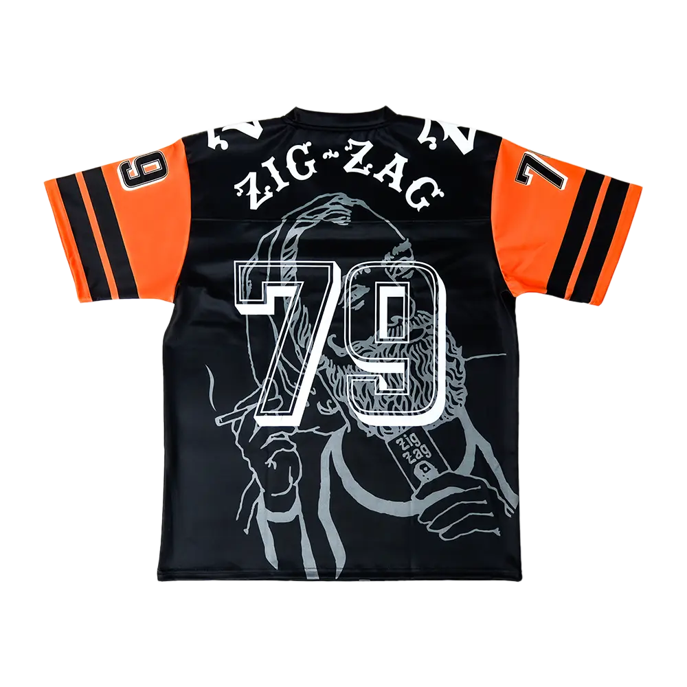 Black Zig Zag jersey with bold “79” number, orange-striped sleeves, and large back graphic featuring the iconic bearded man illustration.