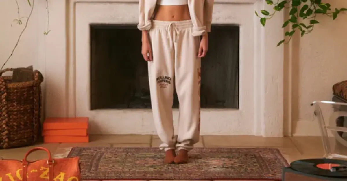 Front view of cream Zig-Zag Motif sweatpants paired with a matching top, standing on a rug