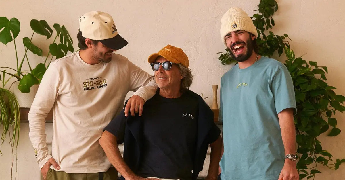 Retro clothes styled with vintage Zig-Zag apparel worn by three smiling men in casual indoor setting
