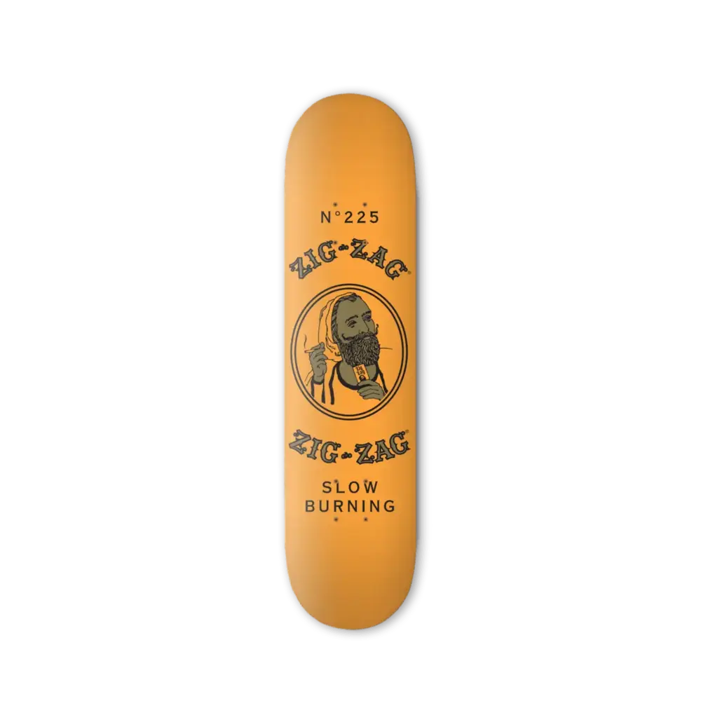 Orange skateboard deck with Zig-Zag branding, featuring a bearded figure and the text "Slow Burning" and "No. 225"